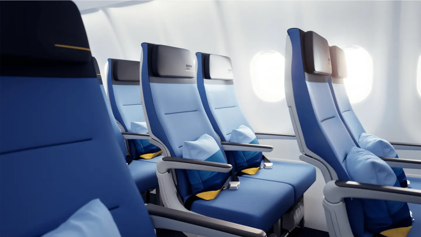 Discover Airlines cabin interior with blue and white seating, designed by PriestmanGoode.