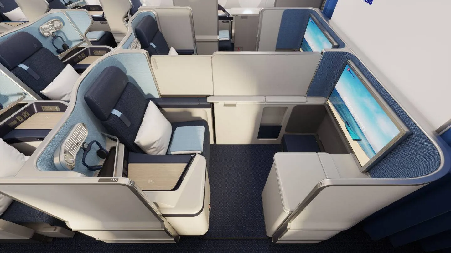 Edelweiss cabin interior with a view of the aisle and seats