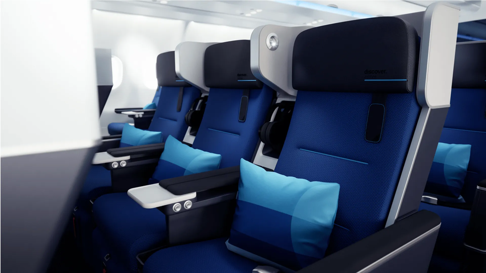 Discover Airlines cabin interior showing a row of seats and window, designed by PriestmanGoode.