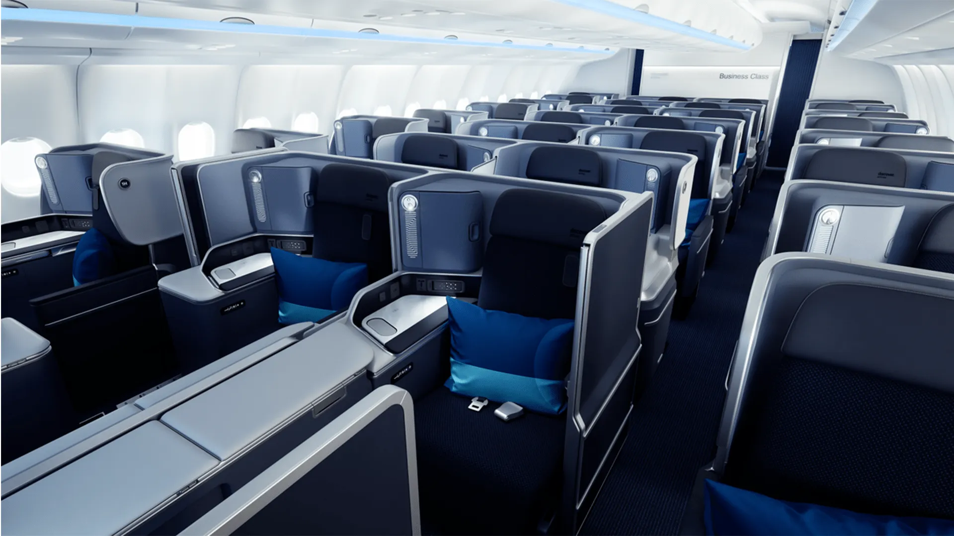 Discover Airlines cabin interior with blue and white patterned seats, designed by PriestmanGoode.