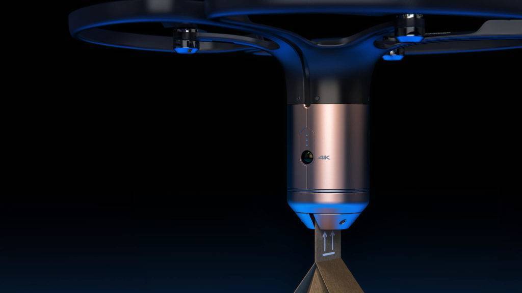Close up view of a drone, showing how it carries a parcel