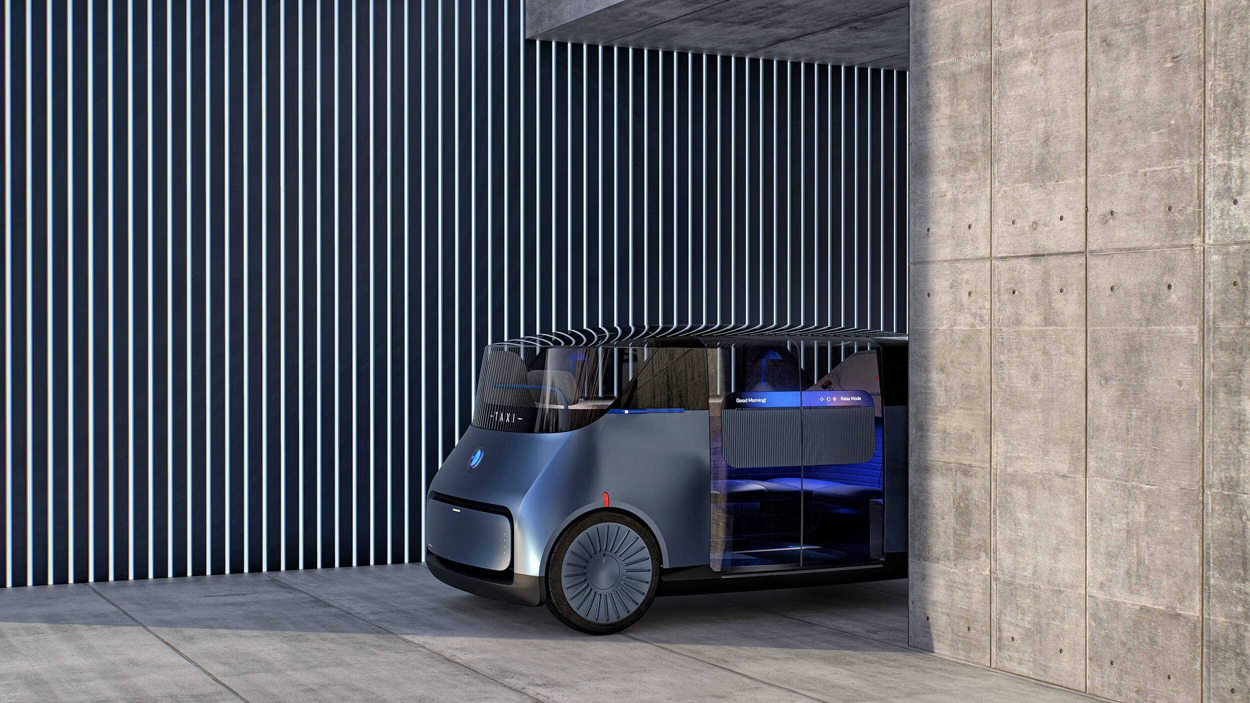 The New Car for London autonomous vehicle in front of a slatted architectural background