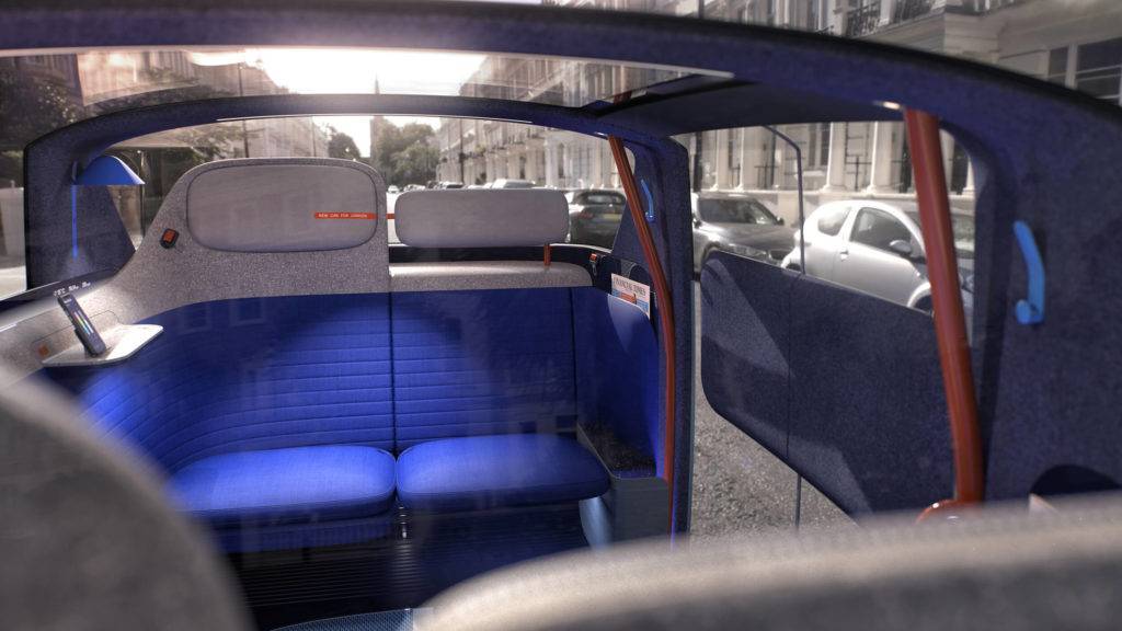 A view of the inside of an autonomous vehicle, highlighting the glass roof, and side windows that fill the car with light