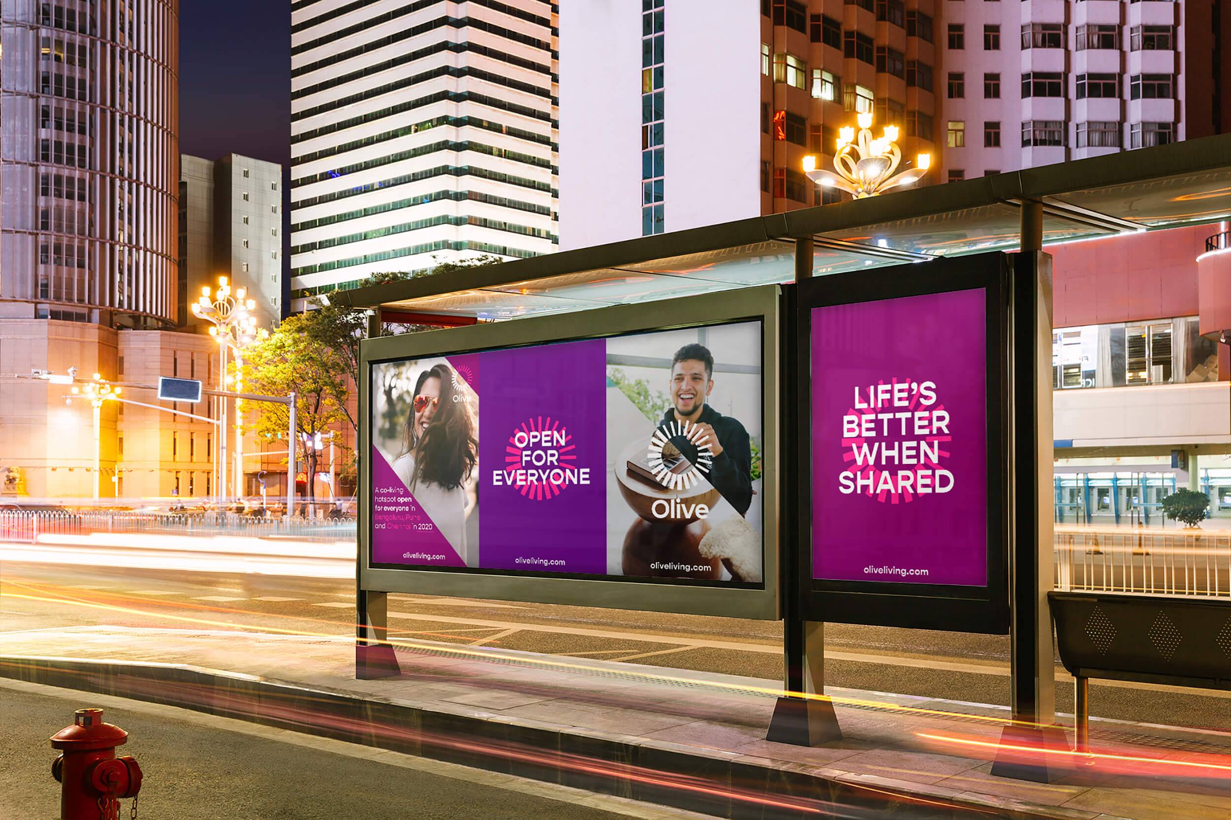 Out of Home Advertising for Olive co-living, shown at a bus stop in a city landscape