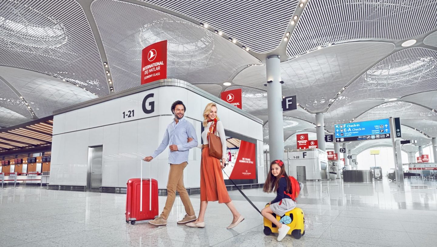 Young family walking through New Istanbul Airport