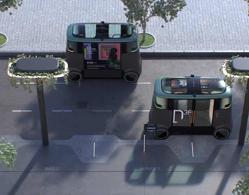 Aerial view of two Dromos autonomous vehicles on a street