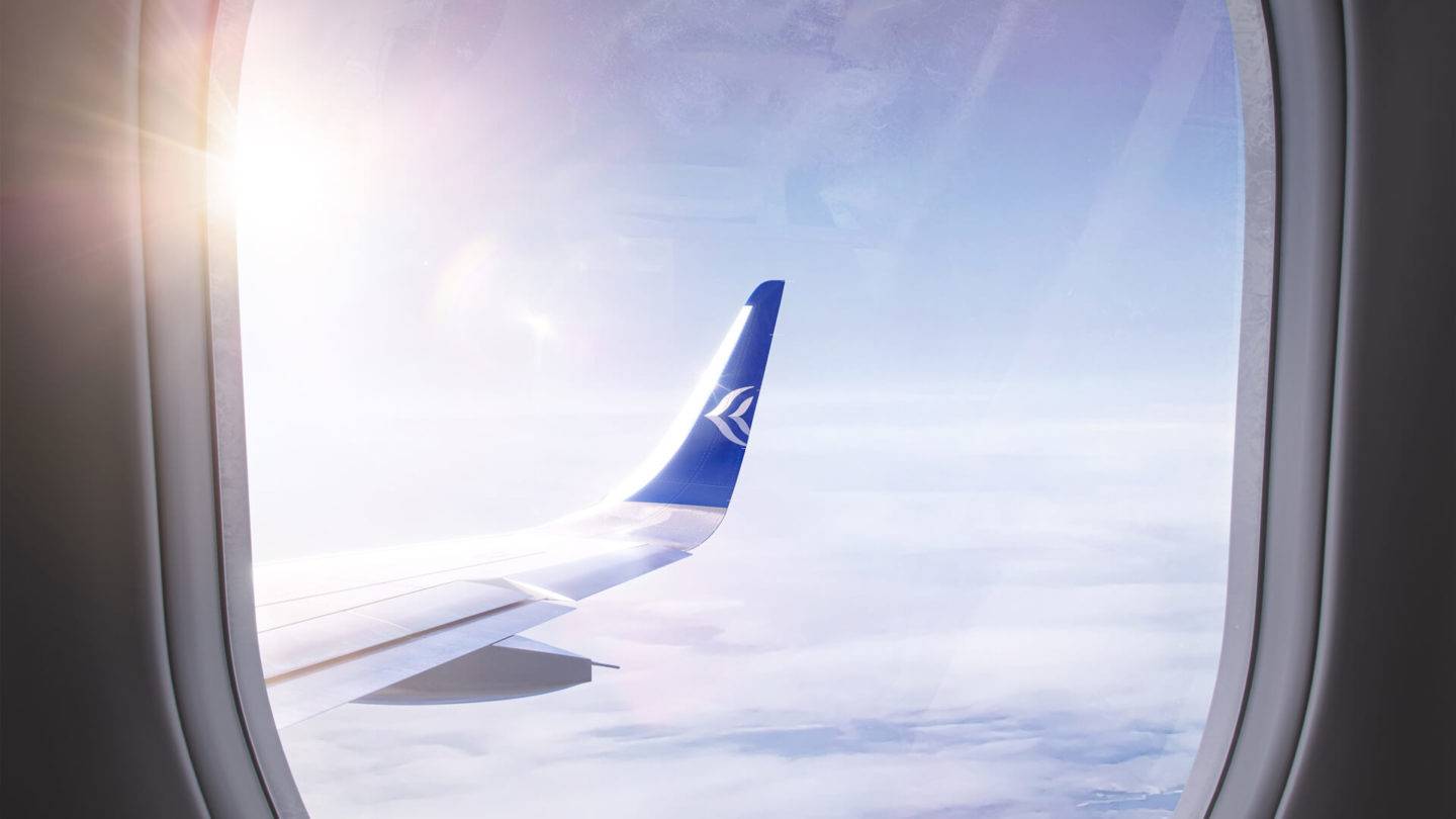 A detail shot of the Aegean Airlines Neo wing tip with the Aegean logo seen through the aircraft cabin window