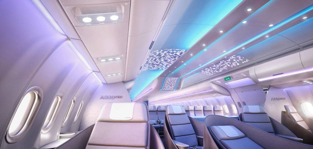 Business Class cabin on the Airbus A330neo, with soothing light blue and purple lighting