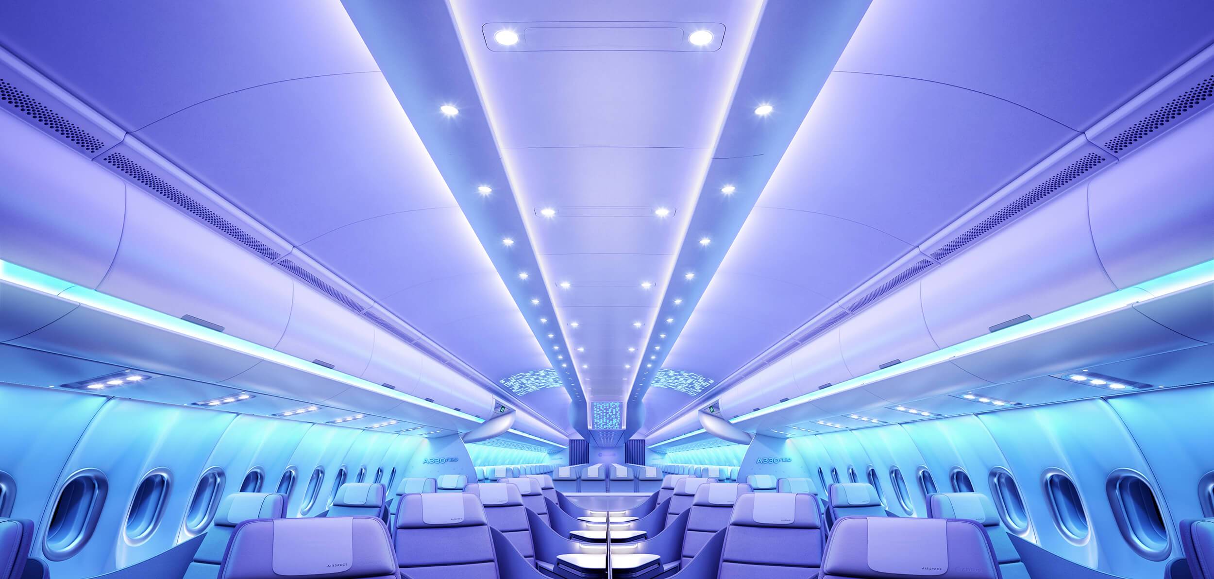 Business Class cabin on the Airbus A330neo at night time, with soothing blue and purple lighting