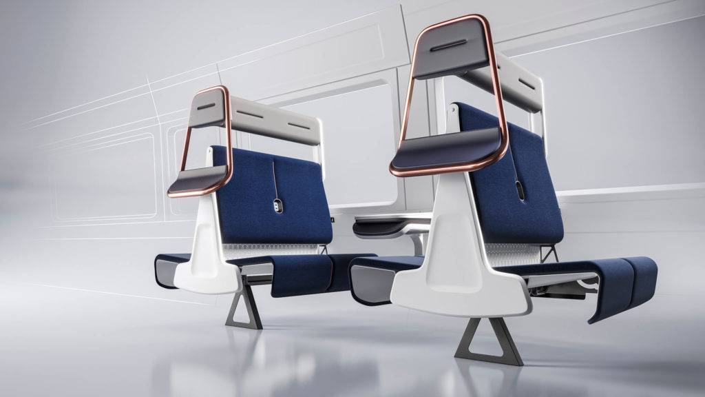 A group of four train seats facing one another. On the side of the seats, a perch seat and headrest have been added