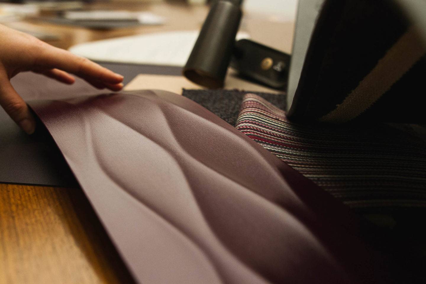 A designer choosing material finishes for Qatar Airways