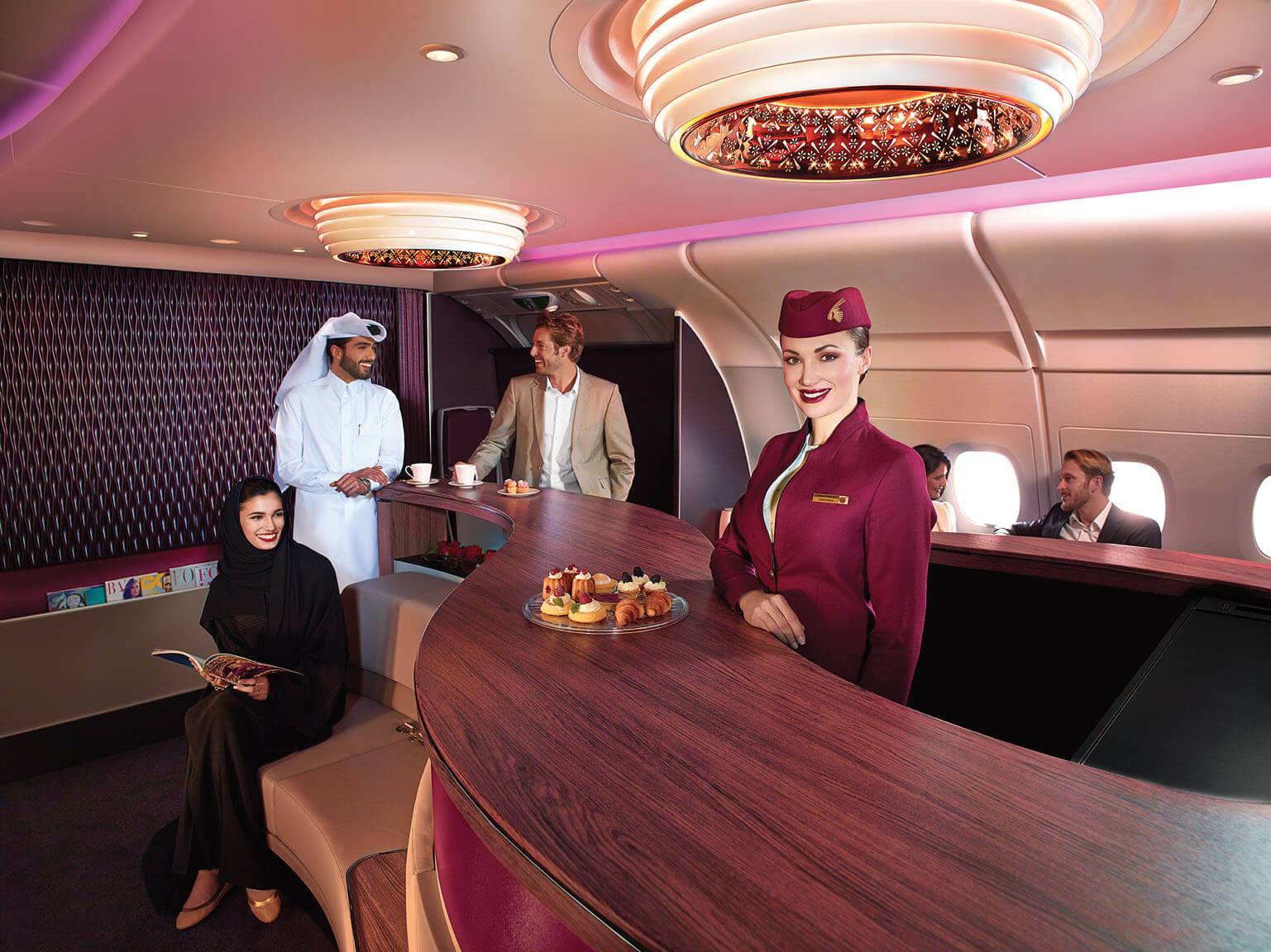 Passengers relaxing and socialising in the Premium Lounge on Qatar Airways A380