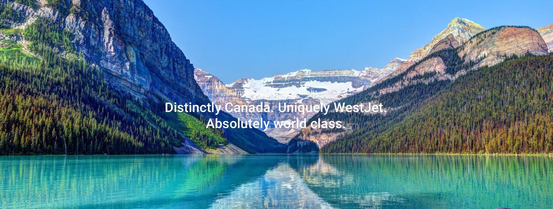 A breathtaking Canadian landscape, showing mountains and a crystal clear lake