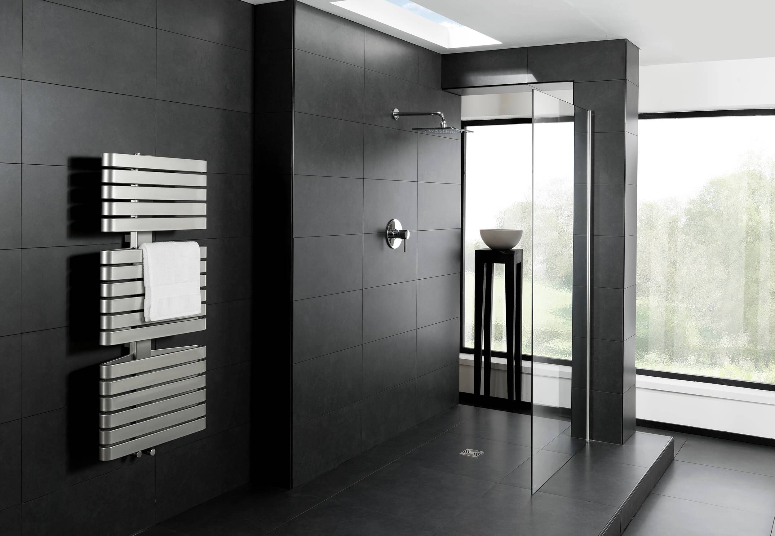 Wall mounted radiator shown in a contemporary bathroom