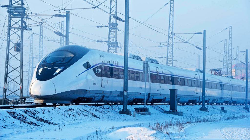 A high speed train in a snowy landscape