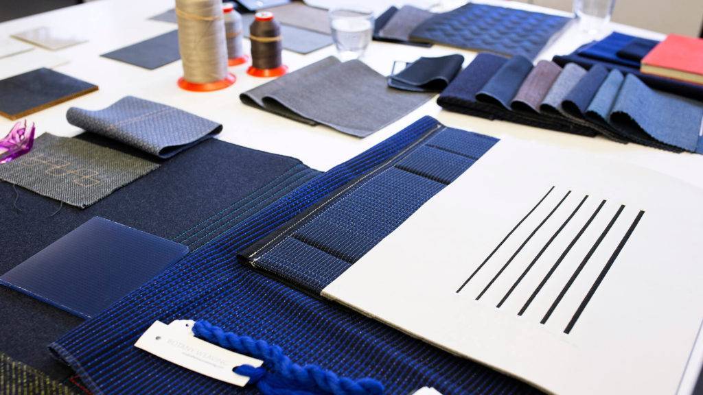 A selection of material samples mostly in different shades of blue