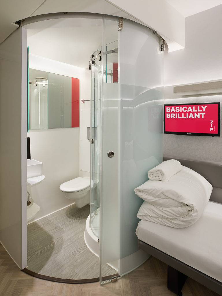 A small en-suite bathroom in a hotel room