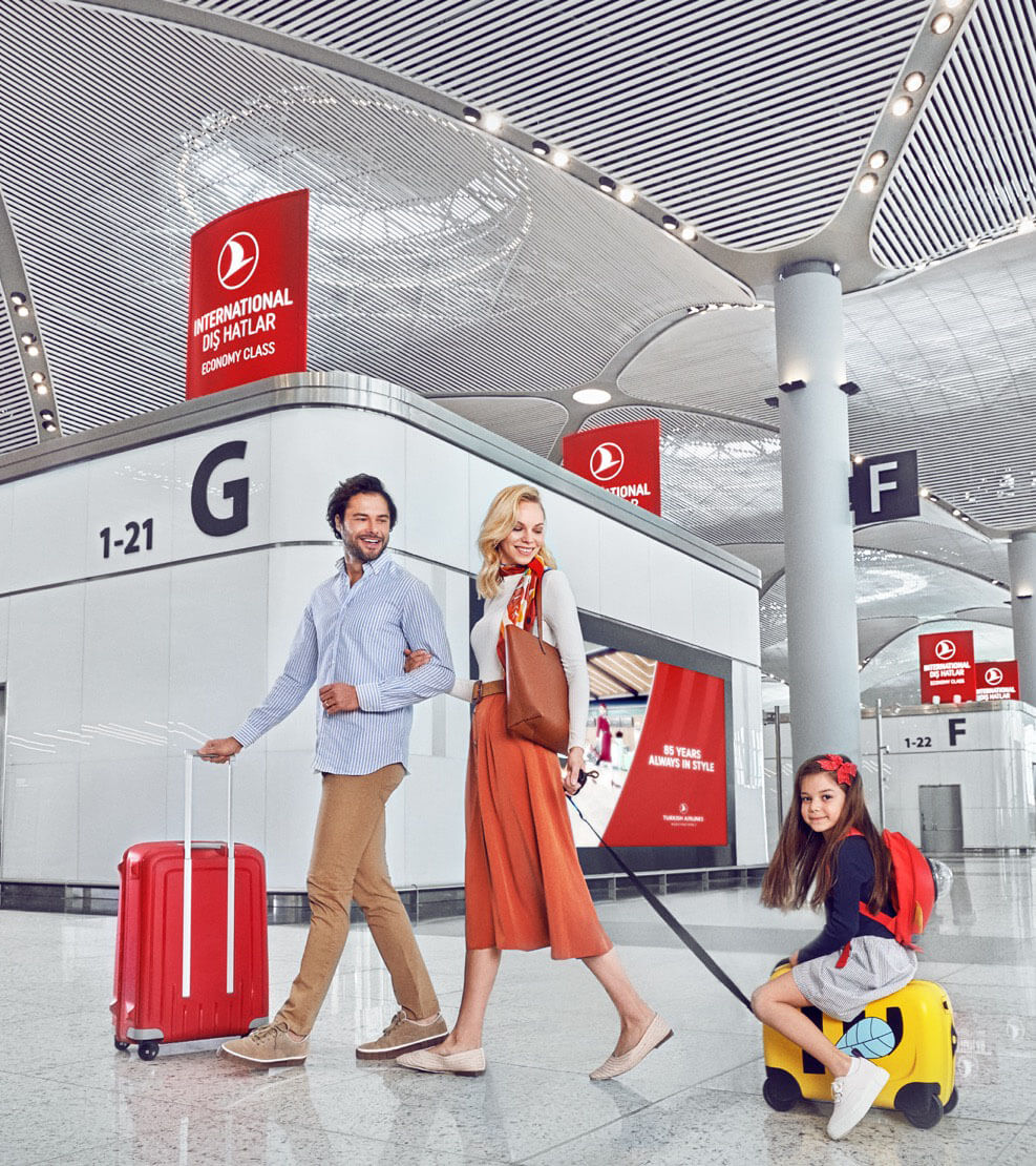 Young family walking through New Istanbul Airport