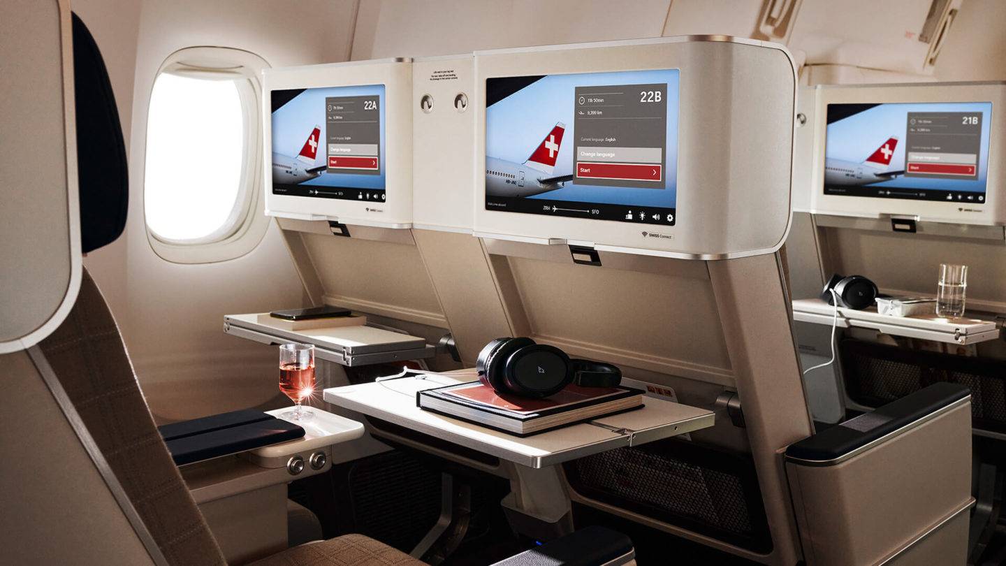 View of the SWISS Premium Economy screens and tray tables